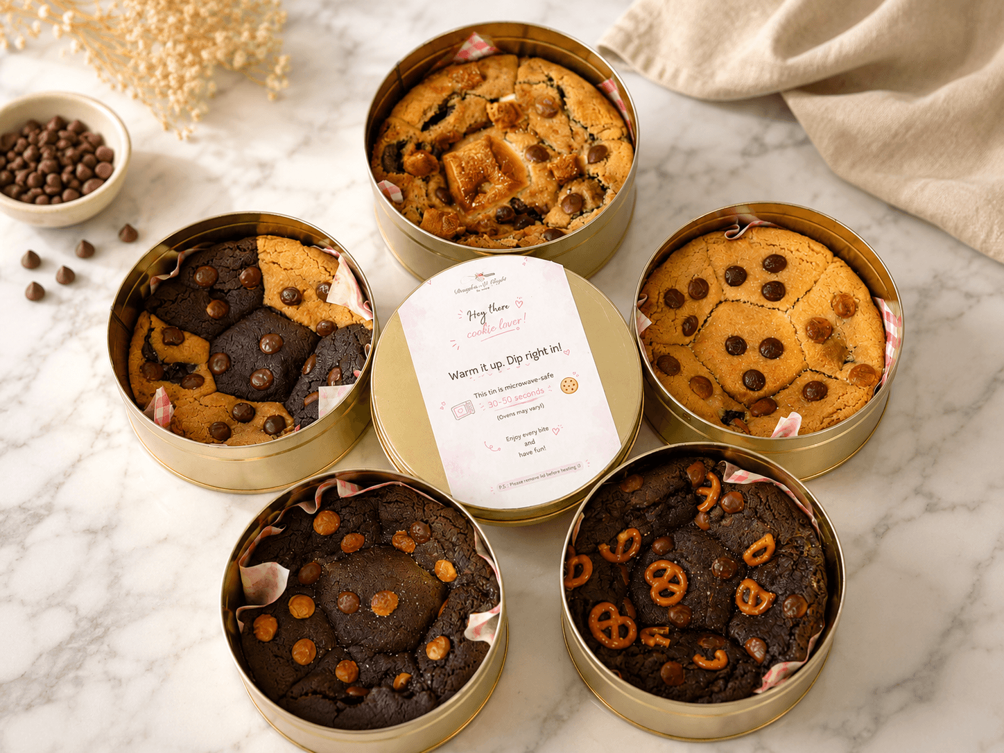 A spread of Doughin it Right cookie tins